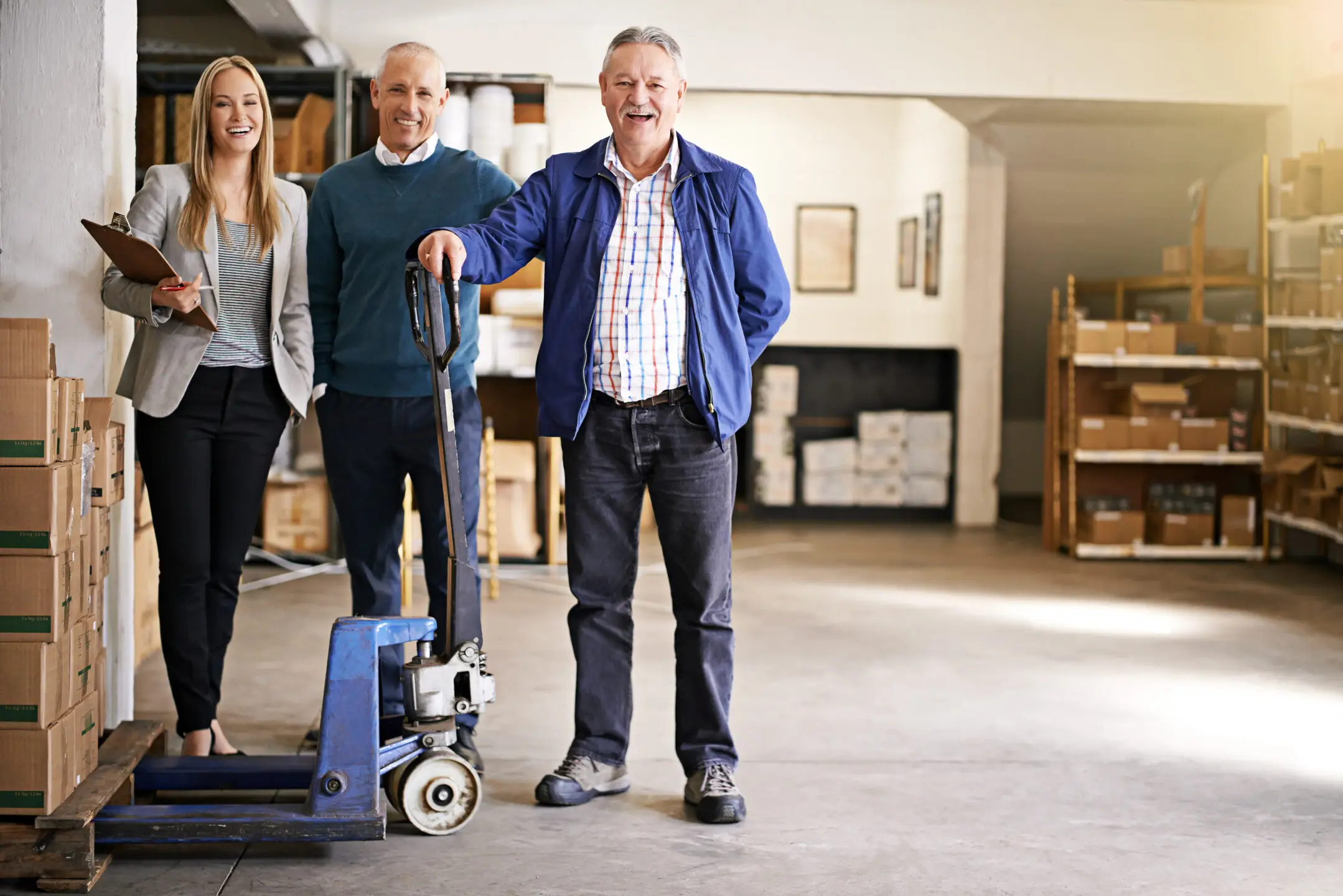 Portrait of a logistics team at work in a distribution warehouse, highlighting the process of evaluating distributors for medical devices and implants, and emphasizing compliance management, inventory tracking, vendor management, and healthcare communication.