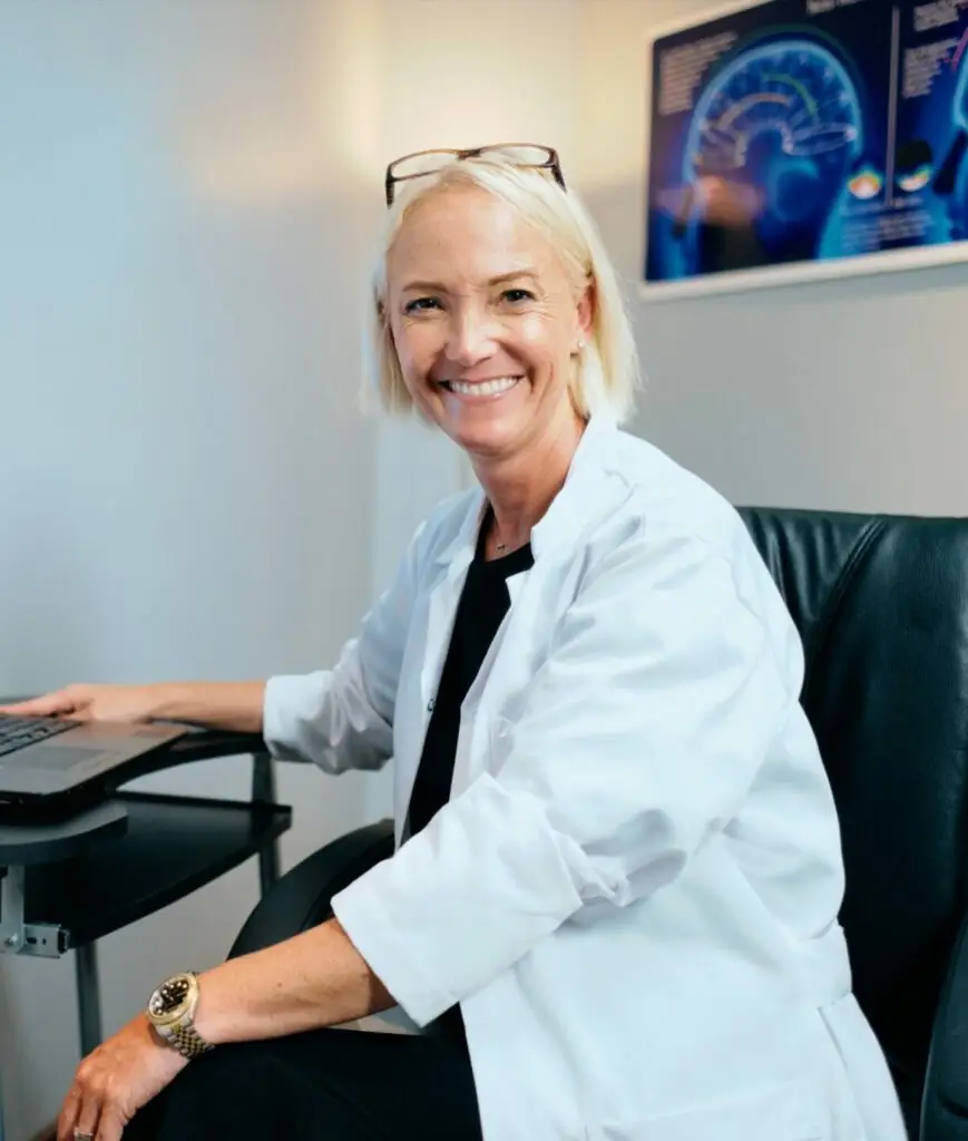 Portrait of a female doctor working in a hospital office, highlighting patient management software, healthcare communication, care coordination, and integrated healthcare.